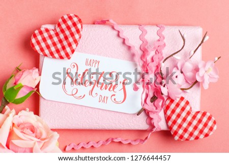 Valentine's day. Greeting card on coral background. Selective focus. Horizontal.