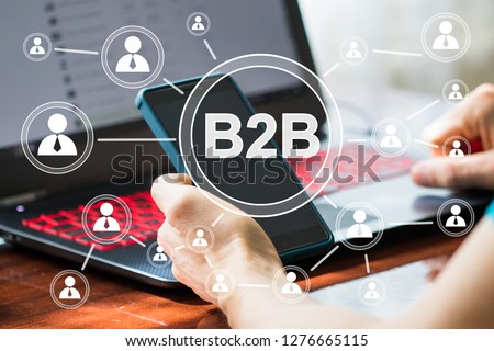 Businessman presses button b2b business-to-business icon on network virtual interface. Royalty-Free Stock Photo #1276665115