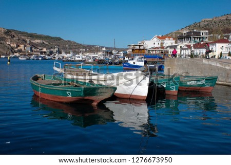 Balaklava bay, fishmen town in Sevastopol, Crimea. Translation: If you see boats it has numbers and letter marks, they need such marks not to be lost when they are fishing.