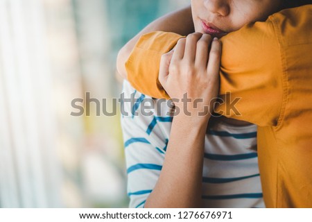 Young depressed asian woman hug her friend for encouragement, Selective focus, PTSD Mental health concept. Royalty-Free Stock Photo #1276676971