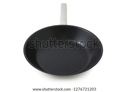 Black frying pan isolated on a white background with clipping path. 