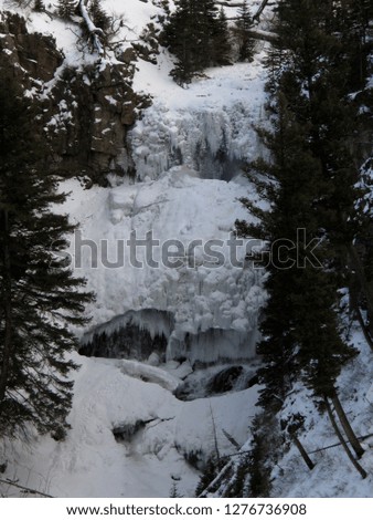 Snow and delicate ice caves in Yellowstone