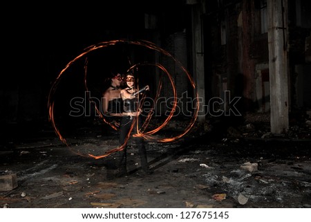 Woman holds in his hand the fire