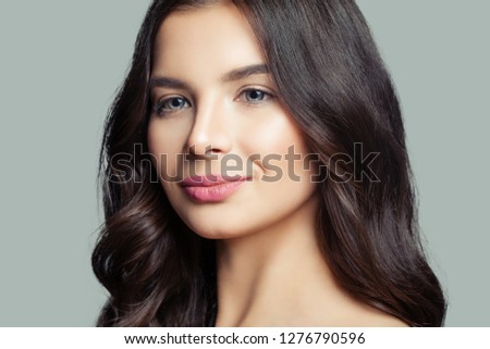 Young woman face closeup. Girl smiling