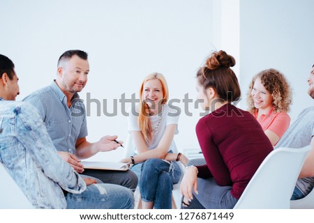 Group of teenagers during psychotherapy with professional counselor Royalty-Free Stock Photo #1276871449