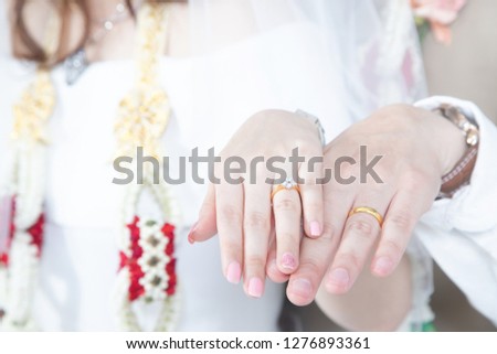 Close up Groom hand and bride. picture of man and woman newly wed couple hands with wedding rings. lover Wedding ceremony.
