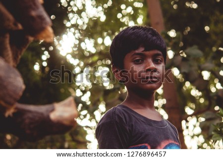 Young Indian boy staring at the camera 