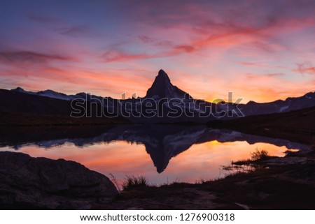 Incredible colorful sunset on Stellisee lake with Matterhorn Cervino peak in Swiss Alps. Zermatt resort location, Switzerland. Landscape photography