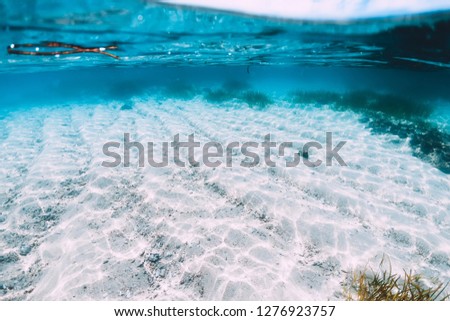 Tropical ocean in underwater. Water and white sand in paradise island