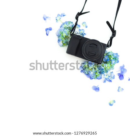 Concept with photo camera and hydrangea flowers on white background. Flat lay, top view.
