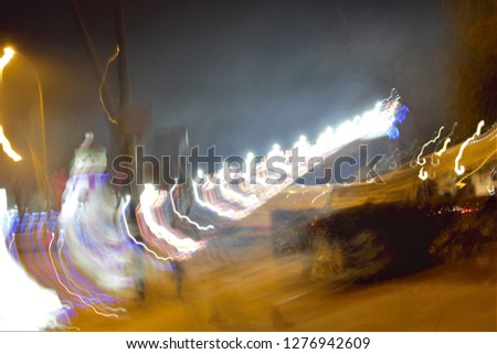 tribute to Ernst Hass, impressionist night photographic sweeps of streets with Christmas lighting, abstract photography at low shutter speed. sensations of celebration and emotion, toledo, spain,