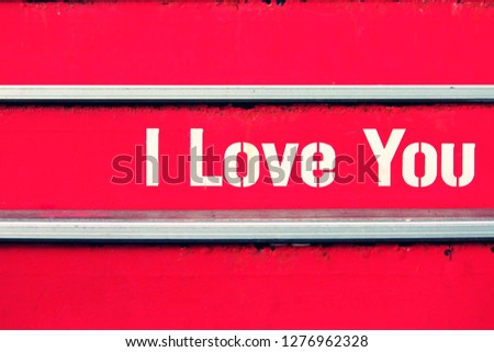 White text I love you on red stair.