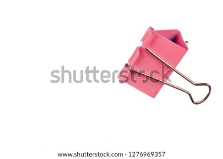 Pink paper clip isolated on white background