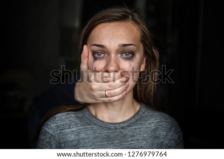 Crying woman after beating by her husband. Female violence concept. Help for women suffering from domestic, woman violence. Women's rights and gender equality Royalty-Free Stock Photo #1276979764