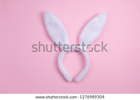 Easter bunny ears isolated on pink background. Happy Easter holiday background concept. minimal concept. Flat lay.Free space for design.