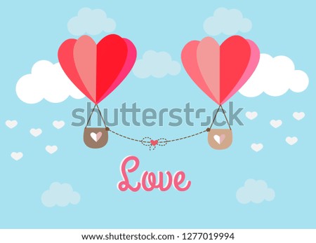 Heart balloon floating in the sky surrounding by white cloud with love text backgruond