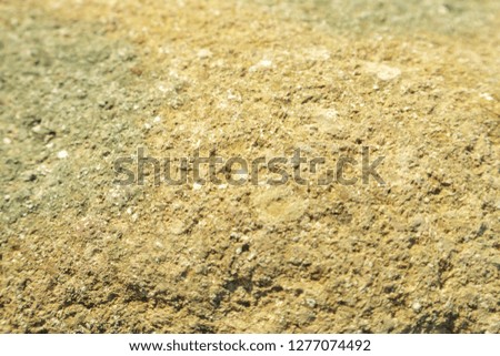 yellow hue rocky rock texture. Horizontal photo