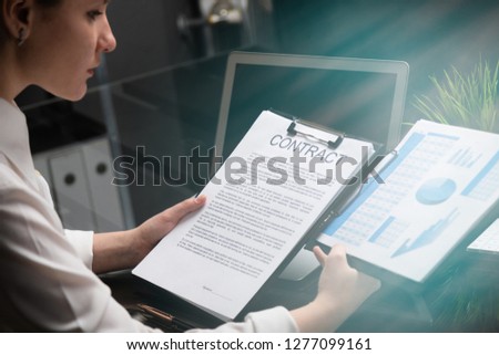 Young girl holding a contract and firm statistics