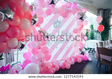 First birthday party of a baby concept made of white and pink colors balloons. Royalty-Free Stock Photo #1277143591
