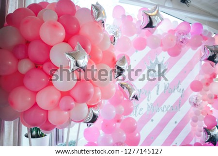 First birthday party of a baby concept made of white and pink colors balloons. Royalty-Free Stock Photo #1277145127