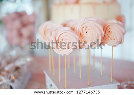 Homemade candies meringue on stick Meringue candy on wooden stick. Festive sweet table for children. Candy Bar Royalty-Free Stock Photo #1277146735