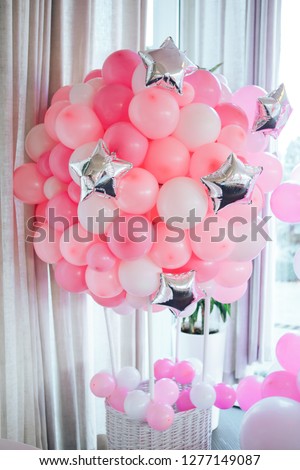 Decorations for holiday party. Pink and white balloons at the birthday. Royalty-Free Stock Photo #1277149087