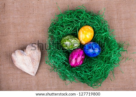 Colorful painted easter eggs in grass
