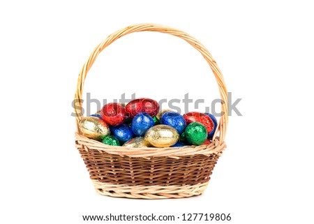 Colorful easter eggs in brown basket