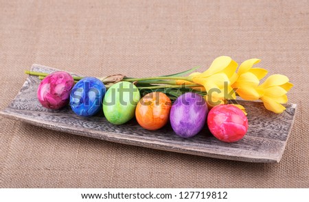 Colorful painted easter eggs on the wood  board