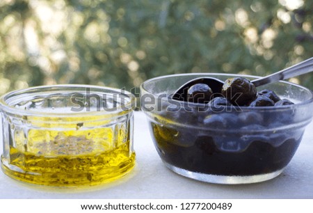 Olives, olive oil and olive tree together concept. Organic and healthy lifestyle, clean eating concept. Traditional Turkish breakfast culture ingredients. Heap of delicious appetizer brunch foods.