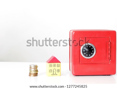 Miniature toy block houses with money box representing property purchase with white background no people stock image and stock photo