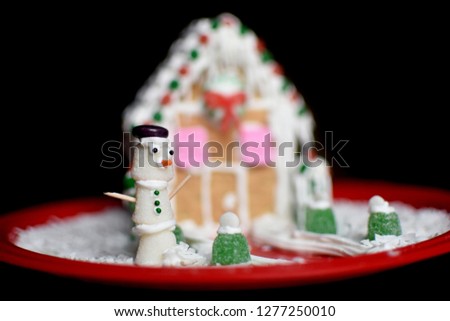 Christmas gum drop snow man in gingerbread scene, shallow depth of field