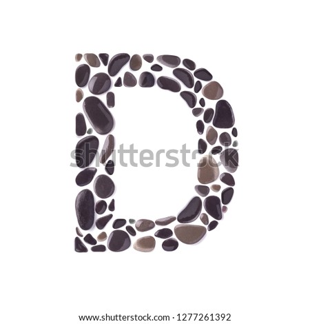 D Letter made of dark wet beach stones isolated on white background