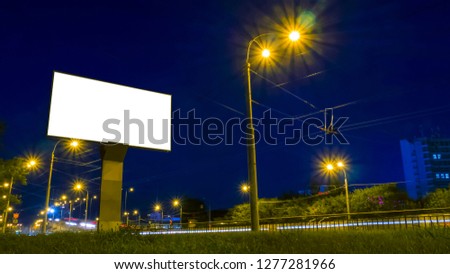 Mock up and template concept - white blank screen mock-up billboard on highway with traffic at evening time