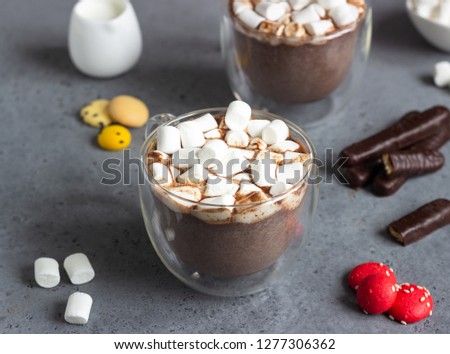 Glass cup of hot chocolate or cocoa drink with marshmallows. Traditional winter or autumn hot drink. Holiday concept, Selective focus. 