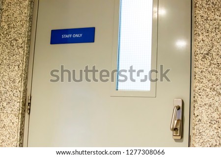 staff only door sign outside workplace
