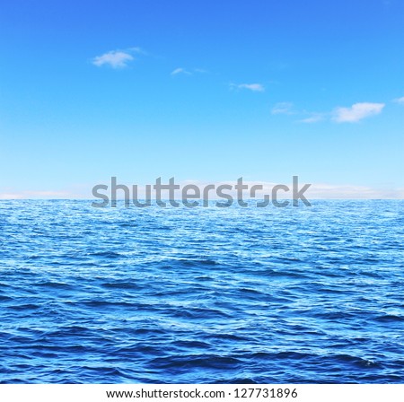 Blue sunny sea and soft sky