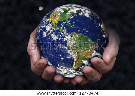 A pair of hands holding the Earth with the moon in the background. Blue Marble picture courtesy of NASA, see http://visibleearth.nasa.gov/useterms.php for terms of use