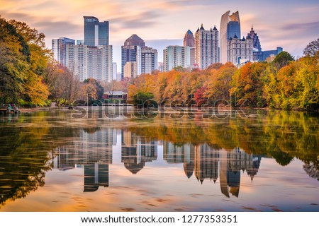 Atlanta, Georgia, USA Piedmont Park skyline in autumn on Lake Meer at dusk.