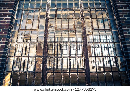 Broken glass windows from abandoned hospital building
