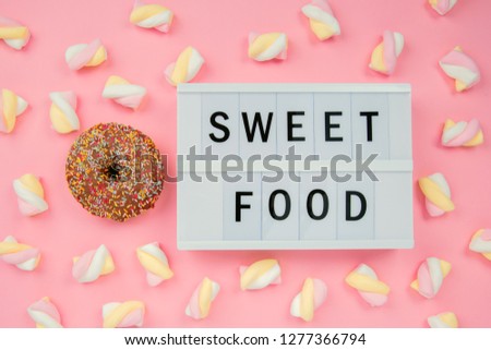 Delicious chocolate Donut on pink Background