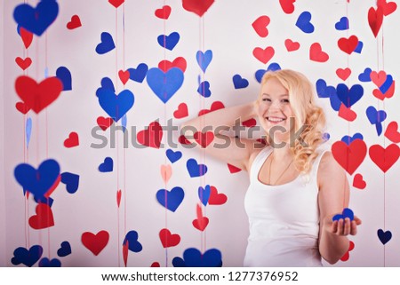 Woman holding Valentines Day heart sign with copy space