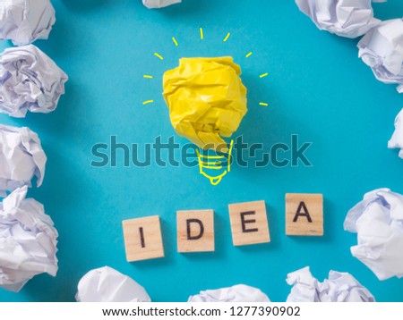 Idea bulb lamp made of paper over blue background, concept of problem and solution