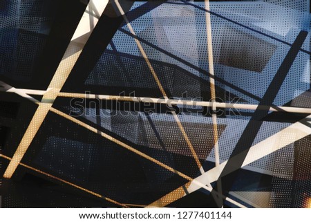 Metal and glass in modern architecture. Collage photo of backlit office building framework and decorative perforated wall panels in twilight. Grid structures seen through each other.
