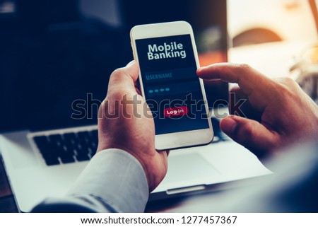 hands using mobile banking on smart phone 
