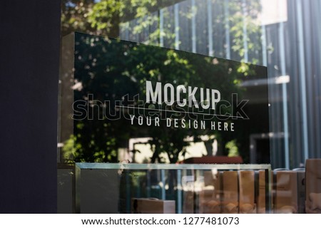 Window sign mockup in a shop Royalty-Free Stock Photo #1277481073