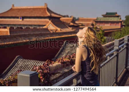 Enjoying vacation in China. Young woman in Forbidden City. Travel to China concept. Visa free transit 72 hours, 144 hours in China