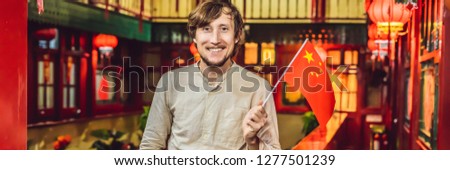 Enjoying vacation in China. Young man with a Chinese flag on a Chinese background. Travel to China concept. Visa free transit 72 hours, 144 hours in China BANNER, LONG FORMAT