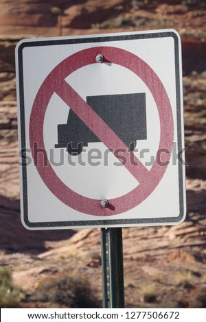 No trucks allowed road sign in the desert near Glen Canyon Dam