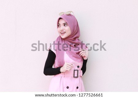 Half body shot of cute hijab lady . Corporate fashion idea.